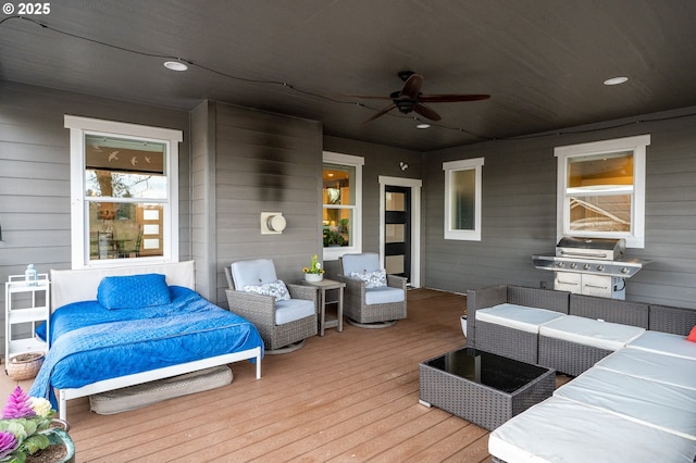 deck with ceiling fan, a grill, and outdoor lounge area