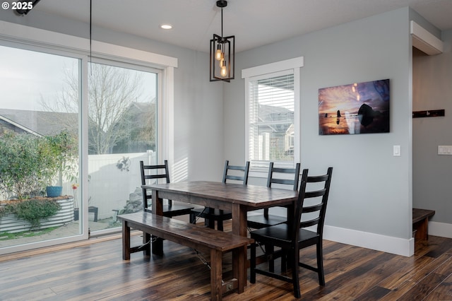 dining area featuring dark hardwood / wood-style flooring and a wealth of natural light