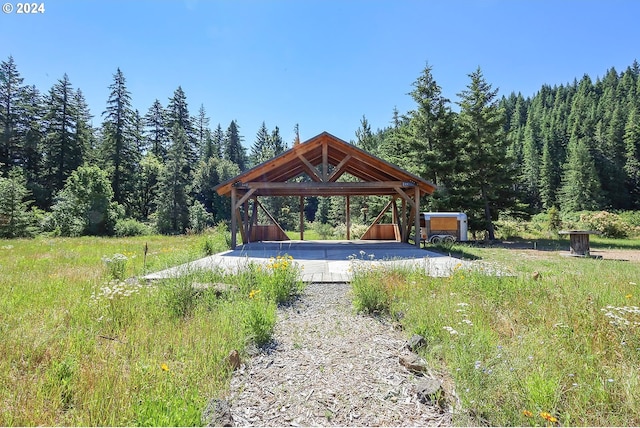 view of yard featuring a gazebo, a carport, and driveway