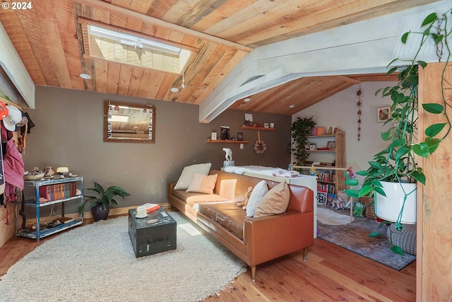 living room featuring hardwood / wood-style floors, wooden ceiling, and lofted ceiling with skylight