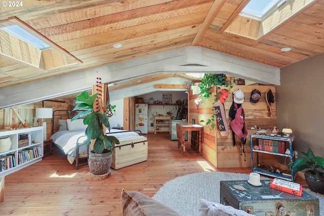 bedroom with wood ceiling, lofted ceiling with skylight, wood-type flooring, and freestanding refrigerator