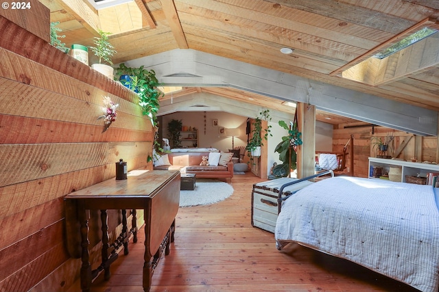 bedroom with vaulted ceiling with skylight, wood walls, wood-type flooring, and wood ceiling