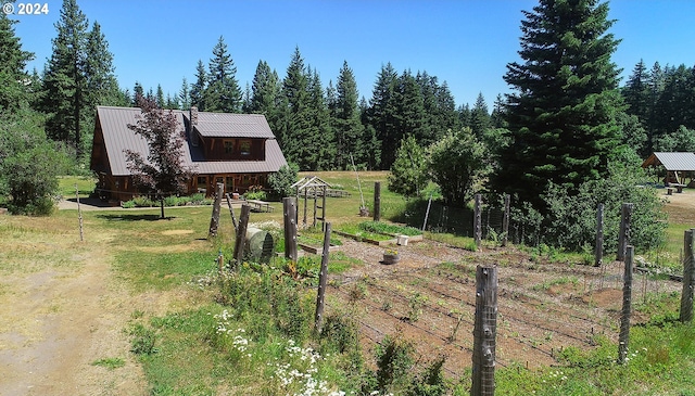 view of yard with a rural view