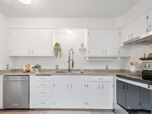 kitchen with appliances with stainless steel finishes, sink, and white cabinets