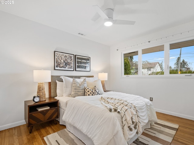 bedroom featuring hardwood / wood-style flooring and ceiling fan