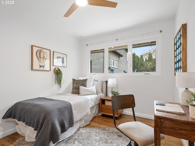 bedroom featuring ceiling fan and light hardwood / wood-style floors