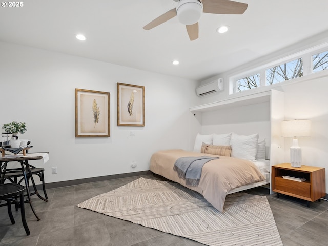 bedroom with a wall unit AC and ceiling fan