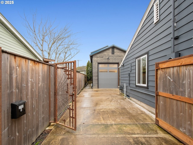 exterior space with an outbuilding and a garage