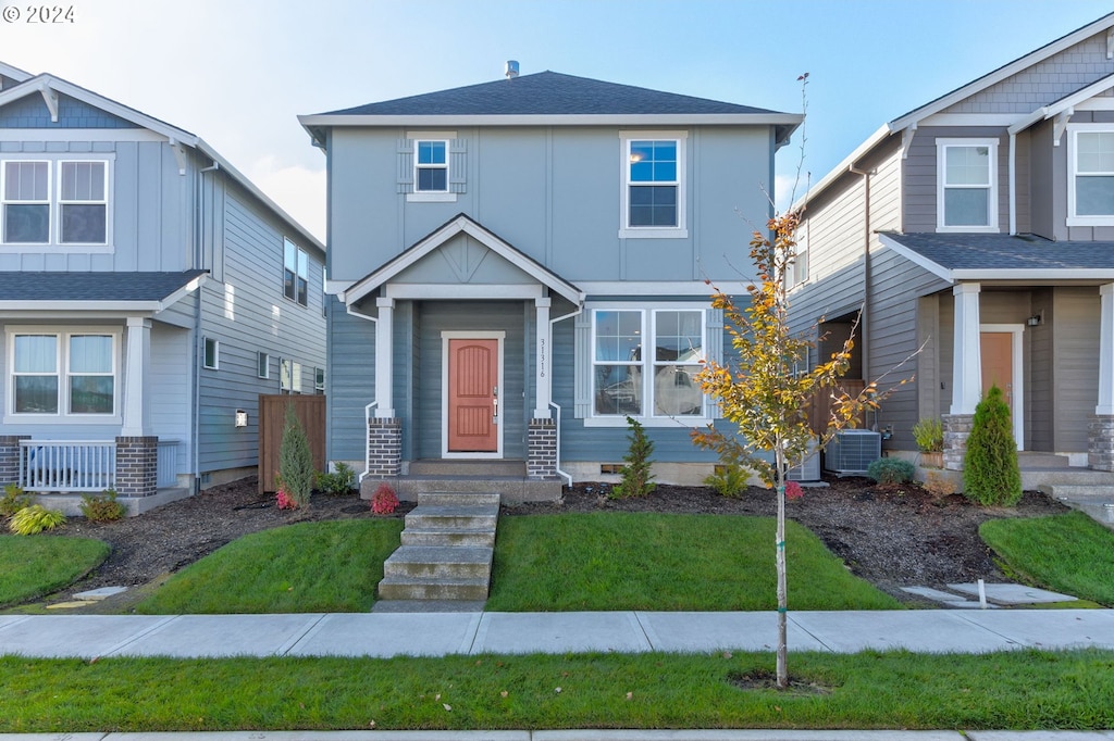 craftsman-style home featuring central AC