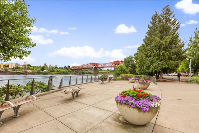 view of patio with a water view