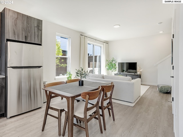 dining area with light hardwood / wood-style floors