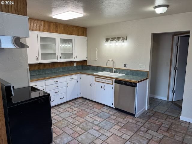 kitchen featuring sink, electric range, white cabinets, dishwasher, and exhaust hood