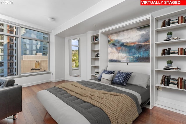 bedroom with hardwood / wood-style floors