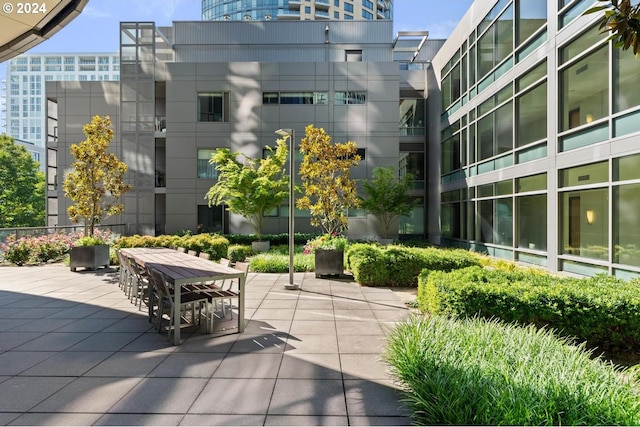 view of home's community with a patio area