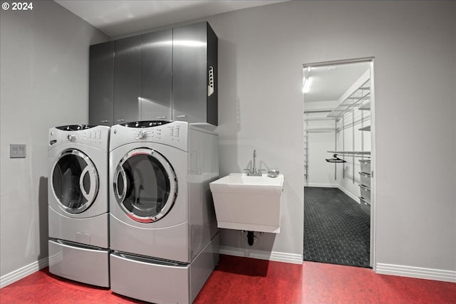 washroom featuring independent washer and dryer and sink