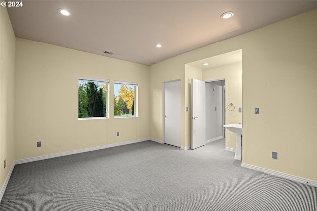 empty room with light colored carpet