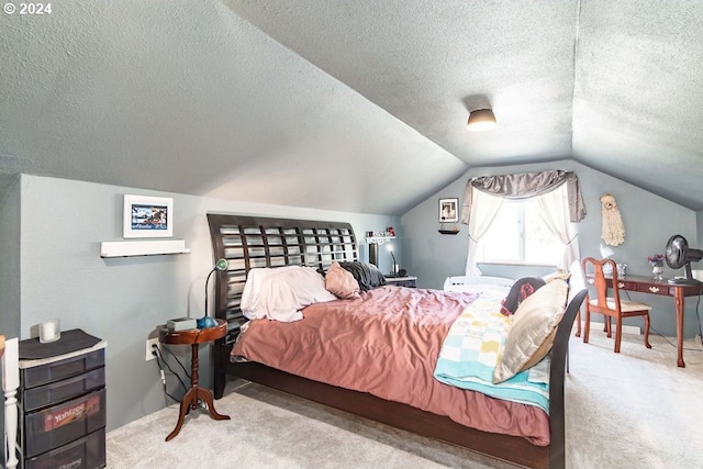 carpeted bedroom featuring a textured ceiling and lofted ceiling