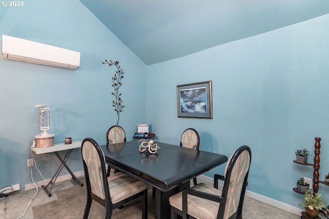 dining space with a wall mounted air conditioner and vaulted ceiling