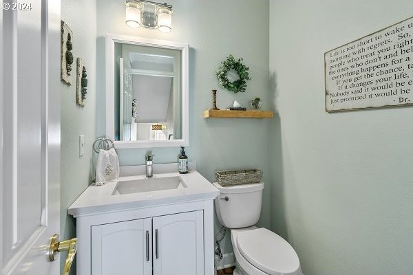 bathroom with vanity and toilet