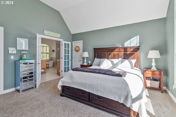 carpeted bedroom with vaulted ceiling