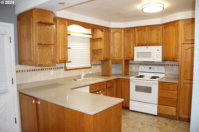 kitchen with kitchen peninsula, sink, backsplash, and white appliances