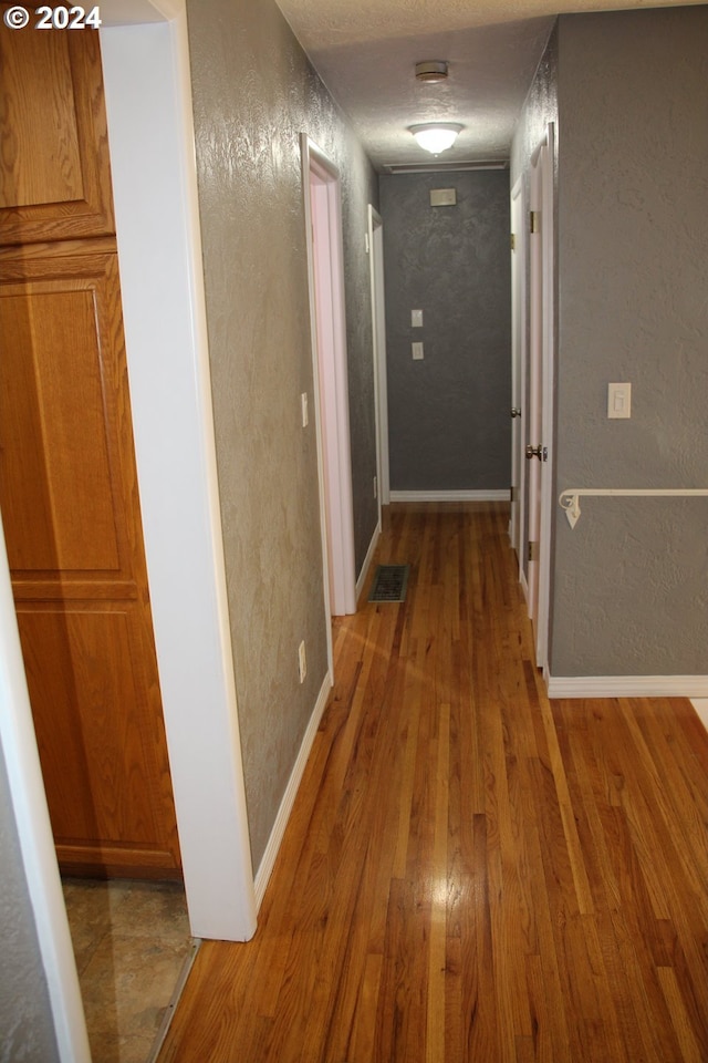 hallway featuring dark wood-type flooring