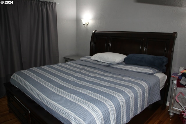 bedroom featuring dark hardwood / wood-style floors