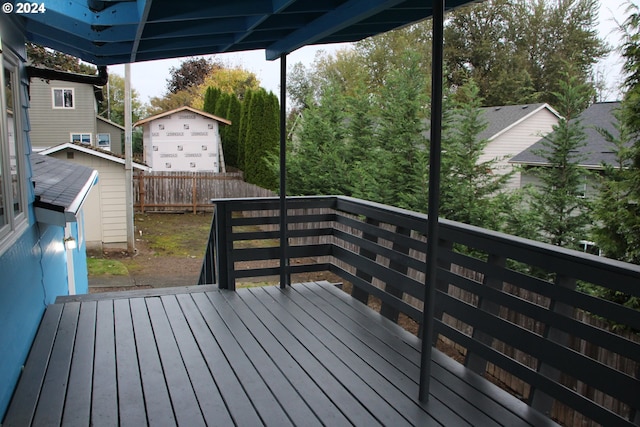 wooden terrace with a storage unit