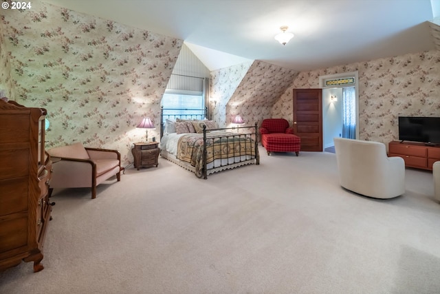 carpeted bedroom featuring lofted ceiling