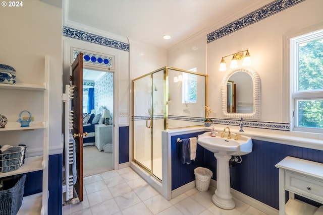 bathroom with tile patterned floors, an enclosed shower, and crown molding