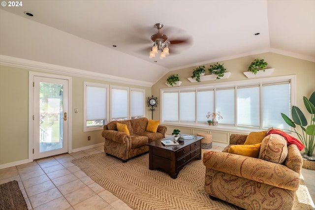 living room with ceiling fan, plenty of natural light, light tile patterned flooring, and lofted ceiling