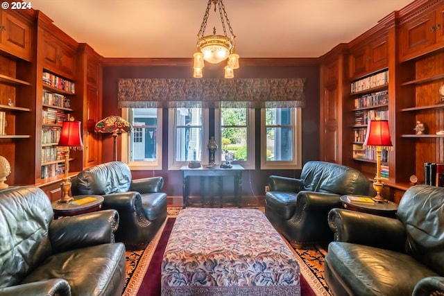 living area with built in shelves and an inviting chandelier