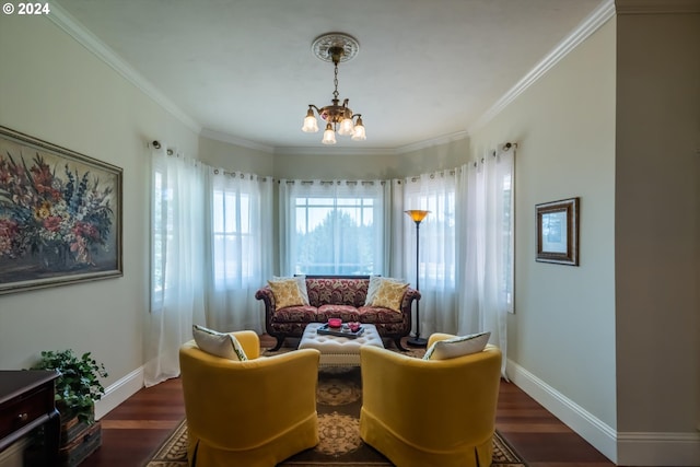 sitting room with an inviting chandelier, dark wood-type flooring, and crown molding