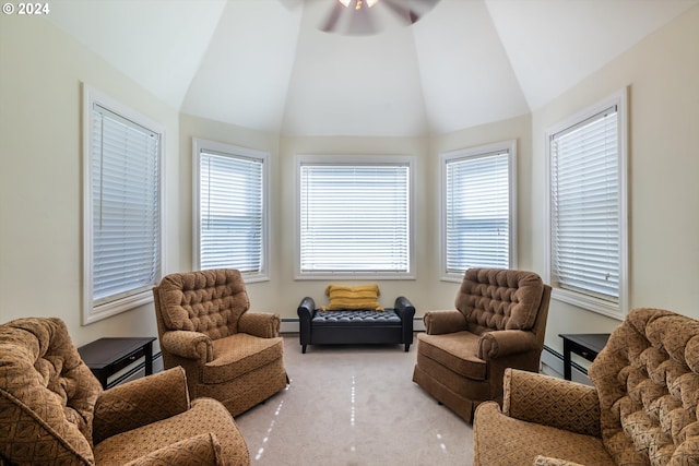 living area featuring ceiling fan, light carpet, a baseboard radiator, and vaulted ceiling