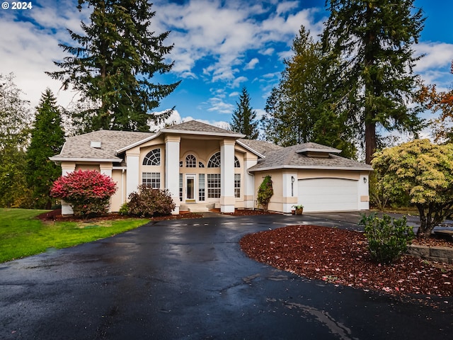 view of front of home with a garage