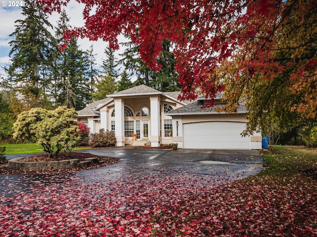 view of front of house featuring a garage and a porch