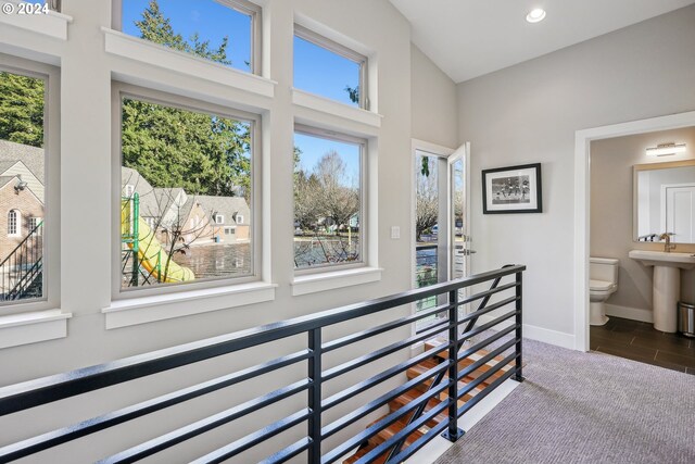 7926 SE 6th Ave Unit 4, Portland, OR 97202 - hallway with an upstairs landing, baseboards, recessed lighting, and a high ceiling
