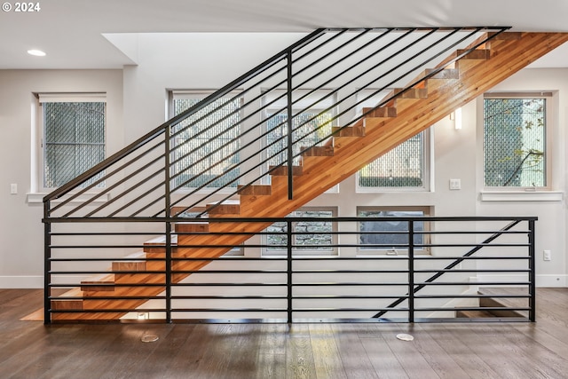 7926 SE 6th Ave Unit 4, Portland, OR 97202 - stairway featuring baseboards, wood finished floors, healthy amount of natural light, and recessed lighting