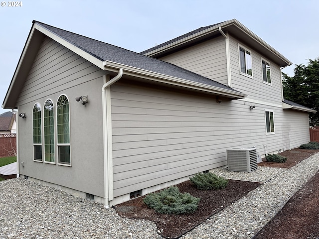 view of home's exterior with central AC