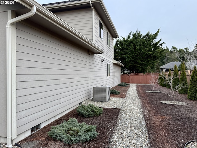 view of side of property featuring central air condition unit