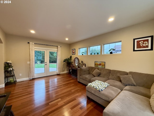 living room with hardwood / wood-style floors and french doors