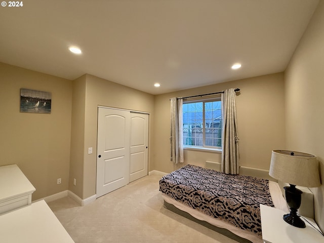 carpeted bedroom with a closet