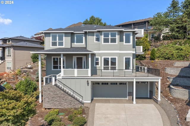 view of front of property with a garage and covered porch