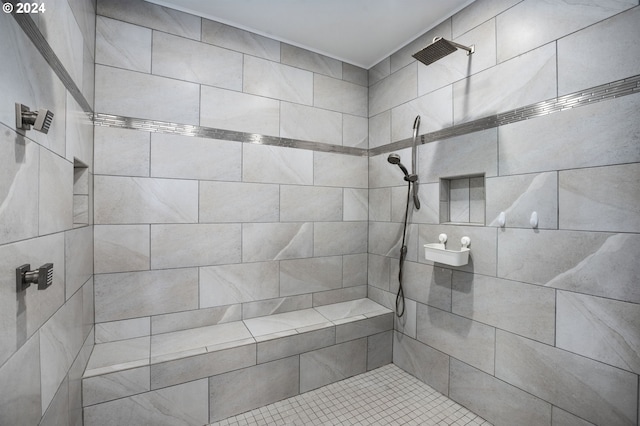 bathroom featuring a tile shower