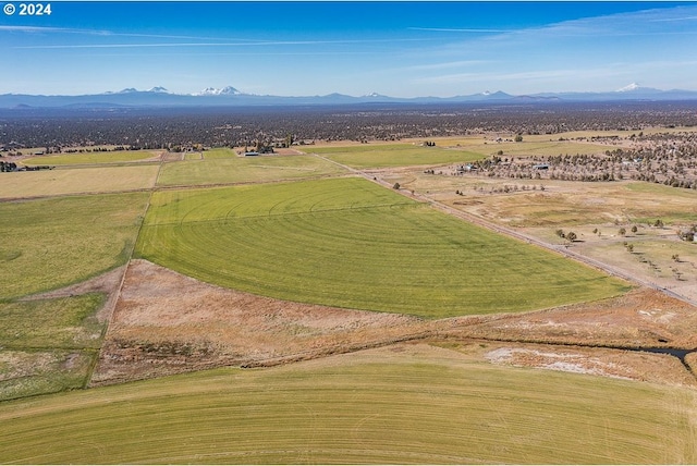 birds eye view of property featuring a rural view and a mountain view