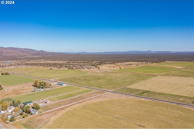 bird's eye view featuring a rural view and a mountain view