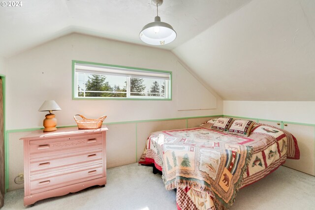 carpeted bedroom featuring lofted ceiling