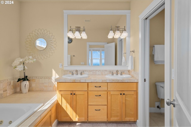 bathroom with a tub to relax in, vanity, toilet, and tile patterned flooring