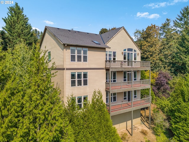 rear view of property with a balcony