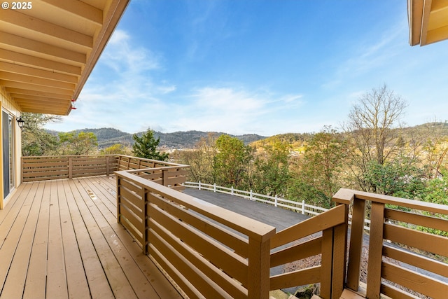 wooden deck featuring a mountain view